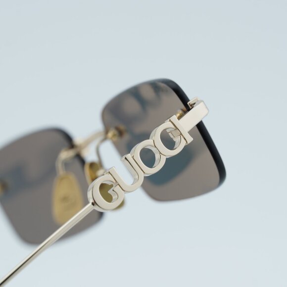 Gucci GG1808S 003 Sunglasses Gold Rectangle Frame, Grey Lenses main image 9
